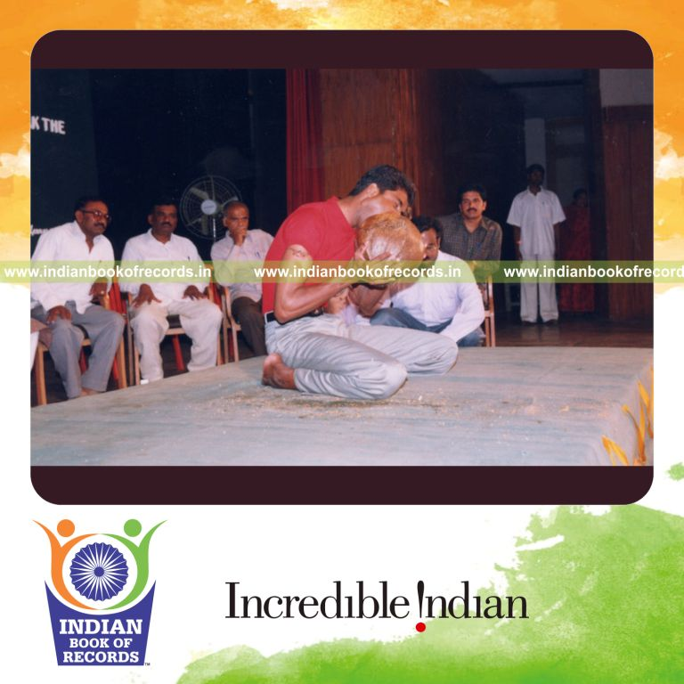 individual husking coconut with teeth in fastest time for Indian Book of Records