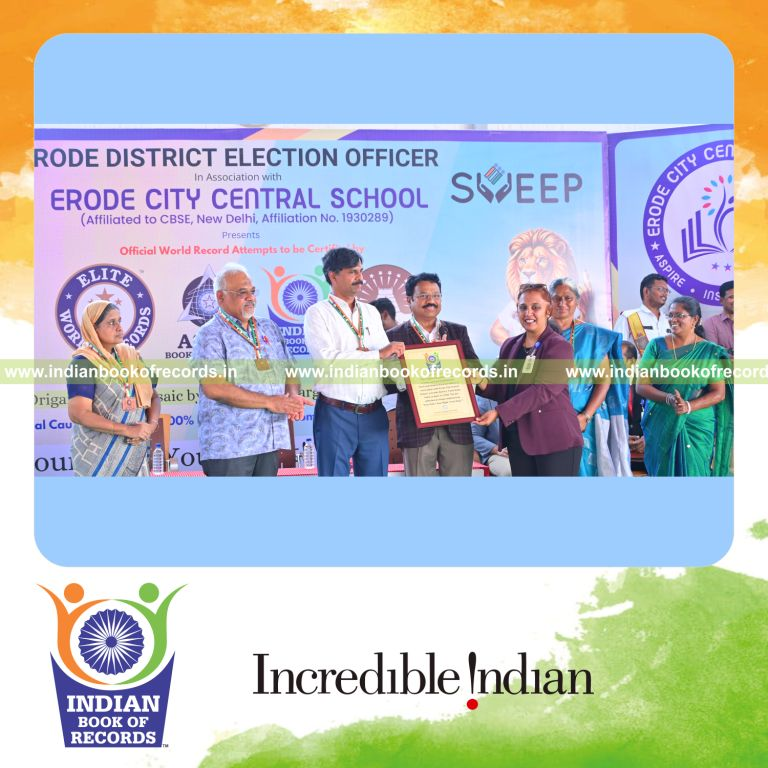 Participants completing a large fingerprint art display, recognized by Indian Book of Records.