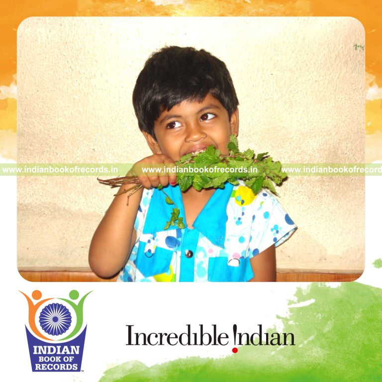 person consuming fresh green leaves as part of record attempt in Indian Book of Records