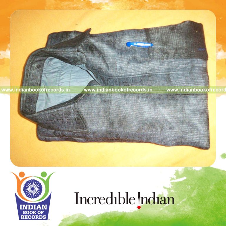 male individual creating shirt using human hair for record achievement in Indian Book of Records