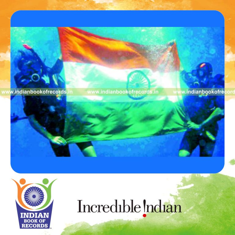 female diver unfurling indian national flag underwater for record in Indian Book of Records