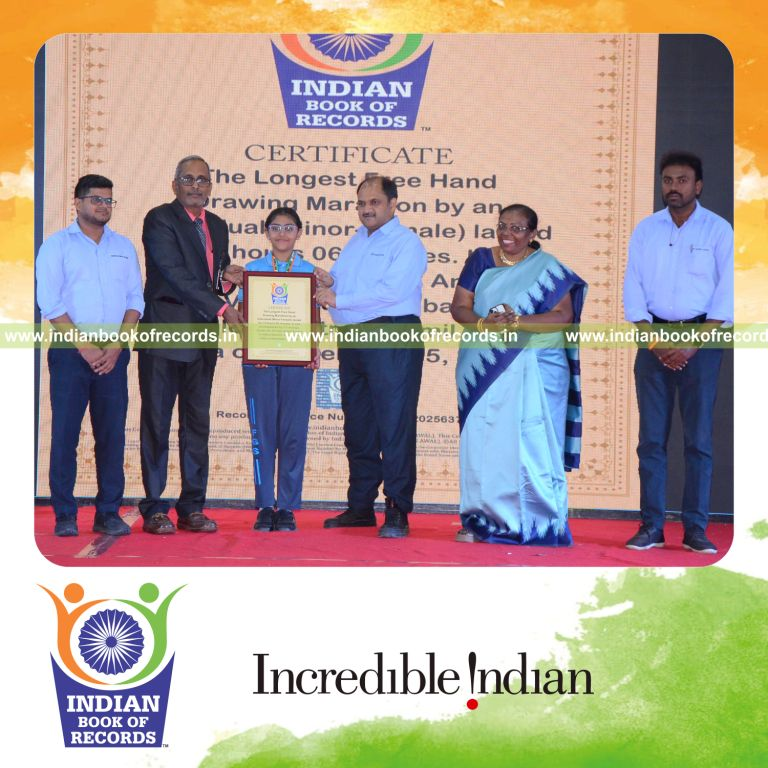 Young artist creating drawings continuously during a long freehand drawing marathon recognized by Indian Book of Records