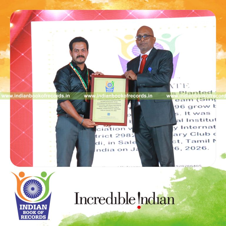 Team members planting seeds rapidly in multiple grow bags during a timed activity at a single location recognized by Indian Book of Records