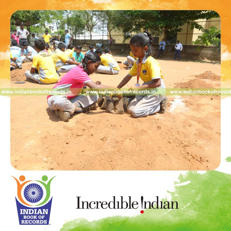 Team planting seeds in numerous grow bags within one hour recognized by Indian Book of Records