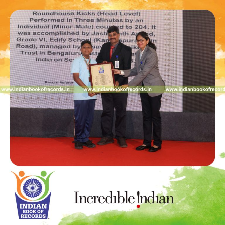Young boy performing rapid high roundhouse kicks consecutively recognized by Indian Book of Records