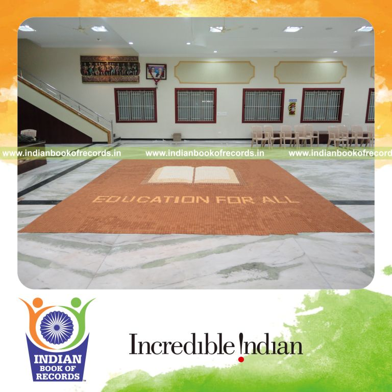 team creating a large mosaic using cookies for record in Indian Book of Records