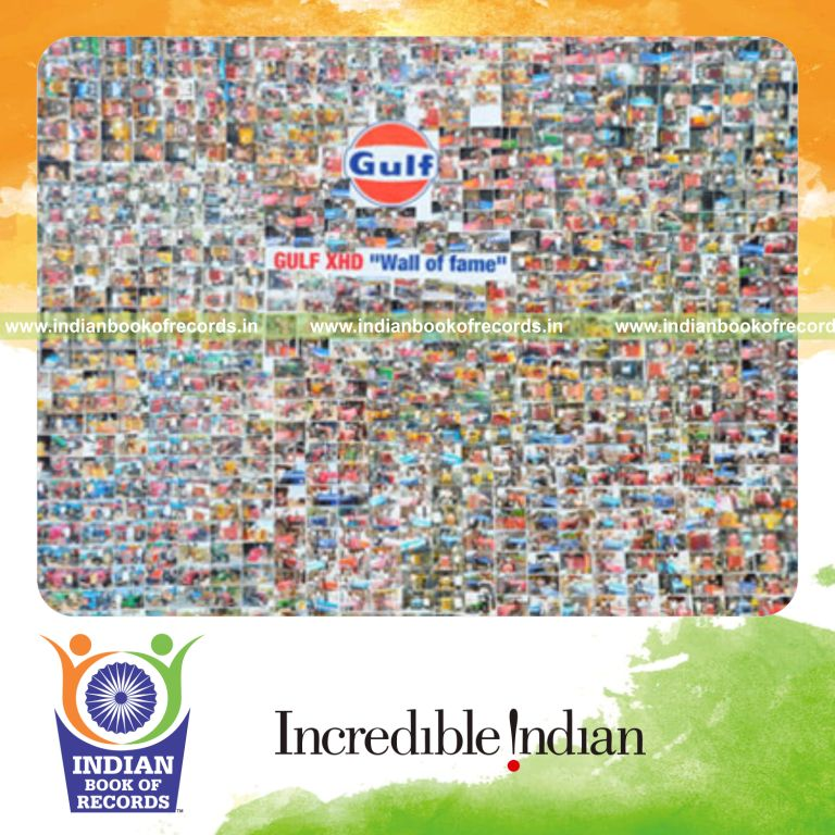 wall covered with multiple tractor photographs for record in Indian Book of Records