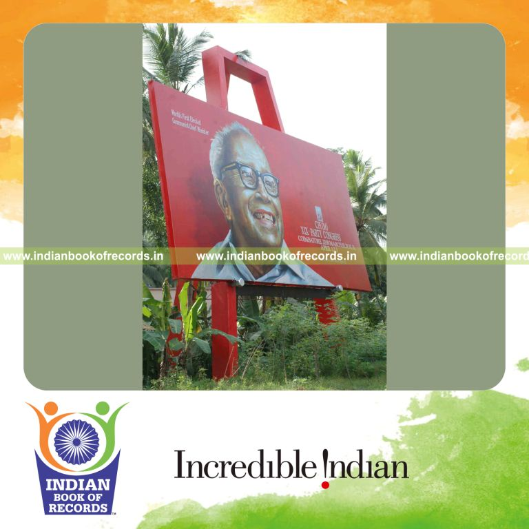 male artist creating large easel ems painting for record in Indian Book of Records