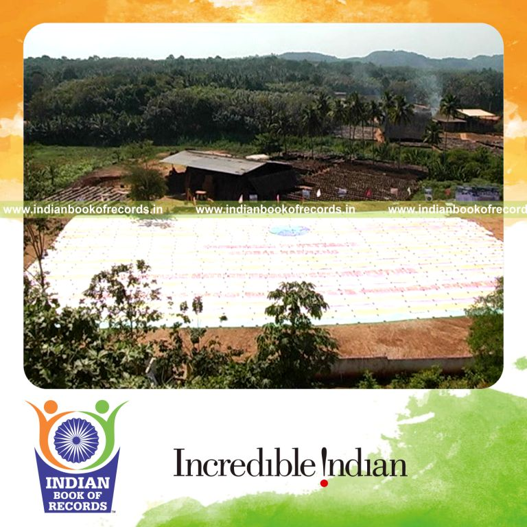 three generations creating a large fingerprint painting for record in Indian Book of Records