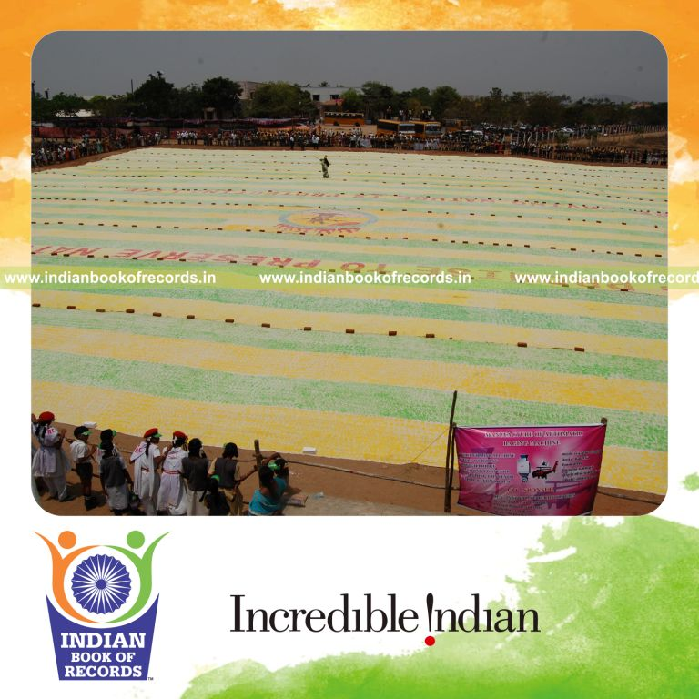 three generations creating a large handprint painting for record in Indian Book of Records