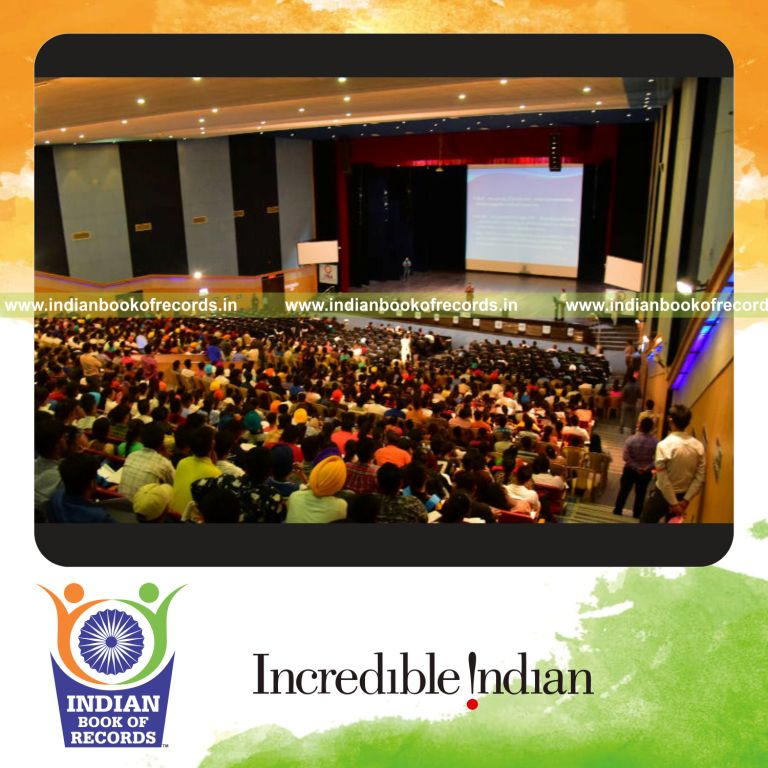 a large group practicing memory improvement techniques together in a structured session for a record in Indian Book of Records