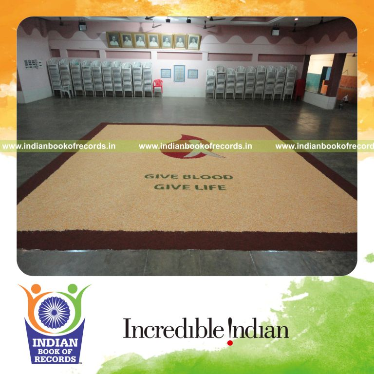 team creating a large mosaic artwork using seeds for an record in Indian Book of Records