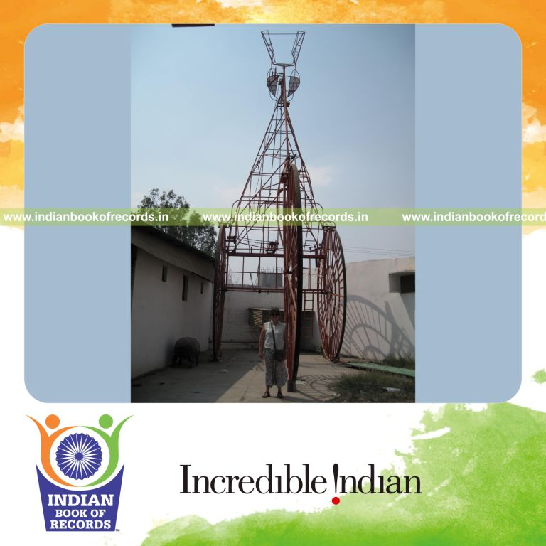 male individual creating a large tricycle for record achievement in Indian Book of Records