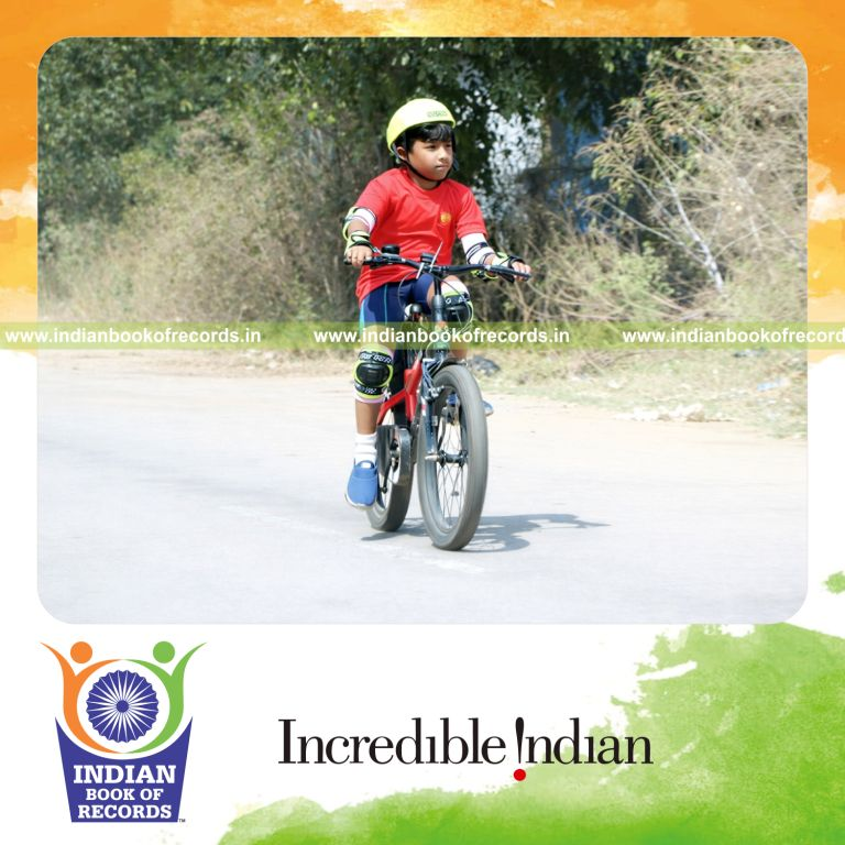Young cyclist covering a long distance within two hours demonstrating endurance recognized by Indian Book of Records