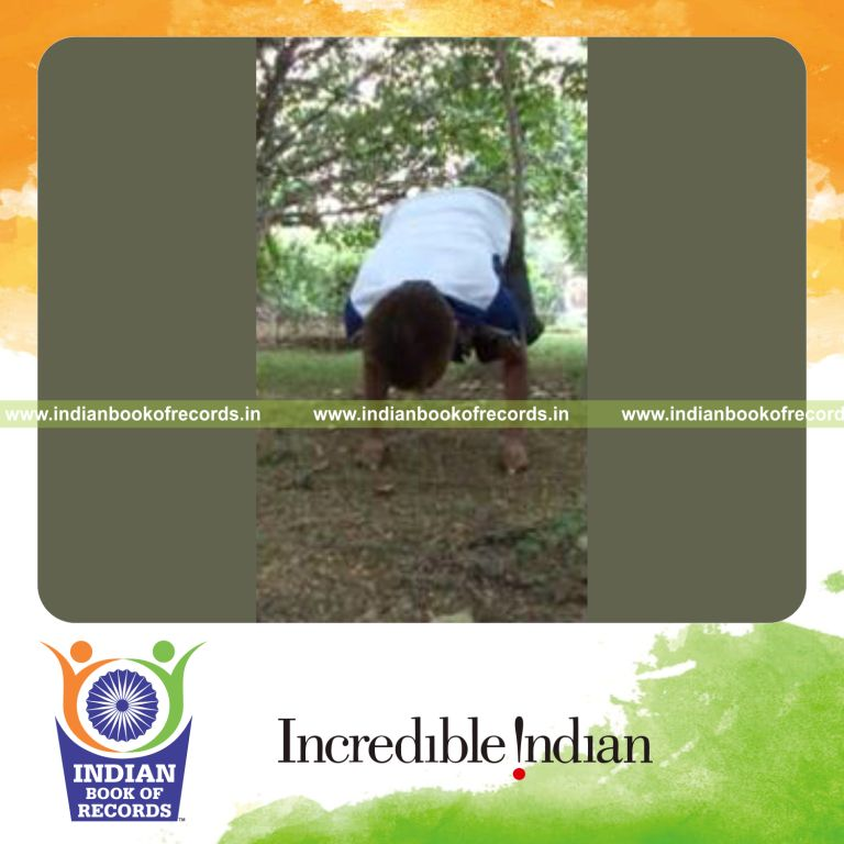 individual holding crow pose on fists for record in Indian Book of Records