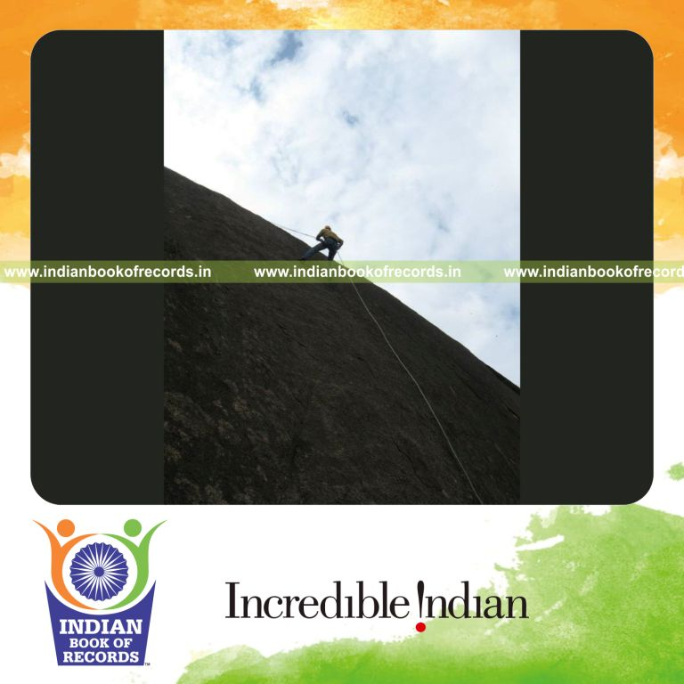male individual performing extended rappelling for record achievement in Indian Book of Records