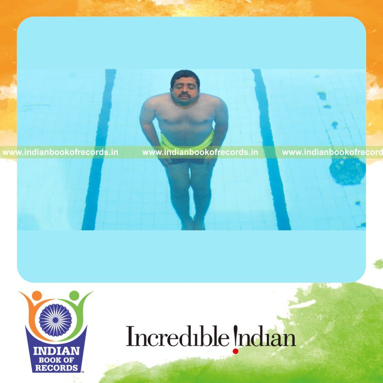 male individual floating on water in perpendicular position continuously for record in Indian Book of Records