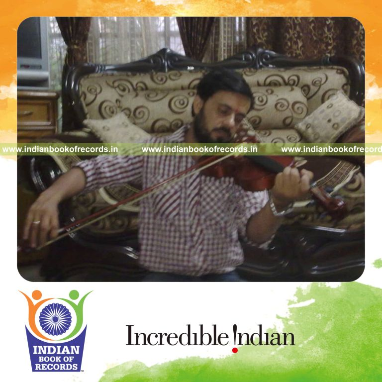 male individual performing extended violin marathon for record in Indian Book of Records