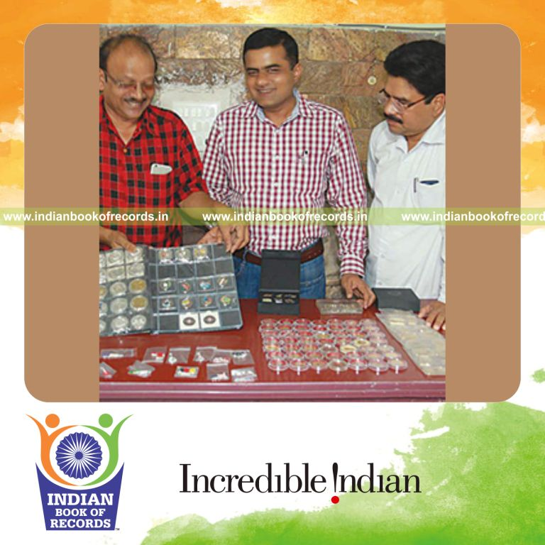 collection of coloured coins by individual male for Indian Book of Records