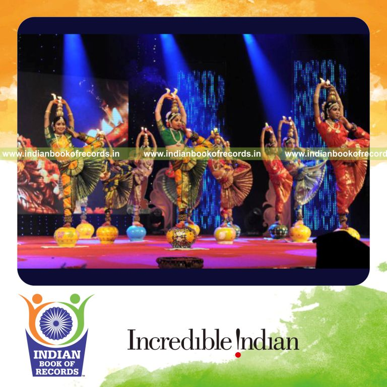 group of dancers performing on inverted mud pots at a single venue for record in Indian Book of Records