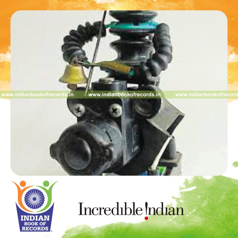 individual creating miniature models using waste materials for Indian Book of Records