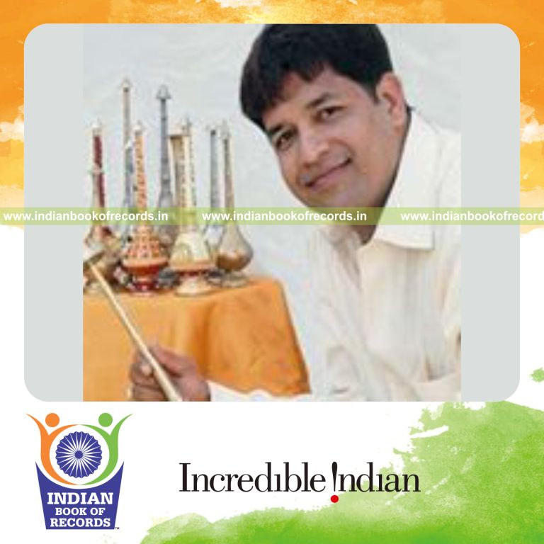 male individual collecting many gulabdanis for record in Indian Book of Records