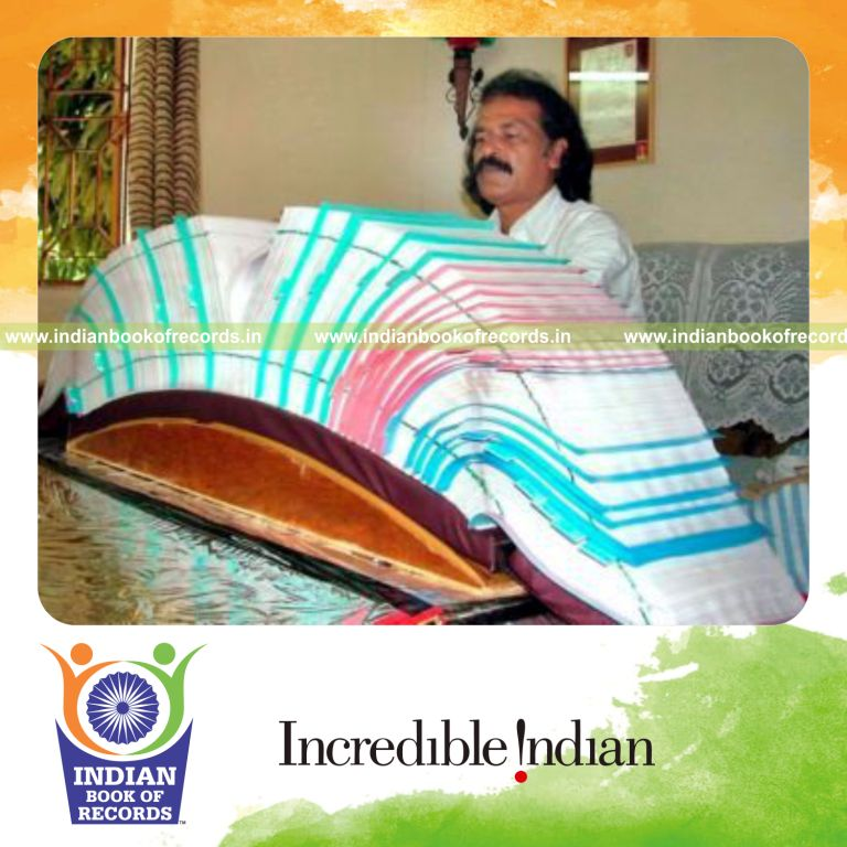 male individual writing handwritten pages of bible for record achievement in Indian Book of Records
