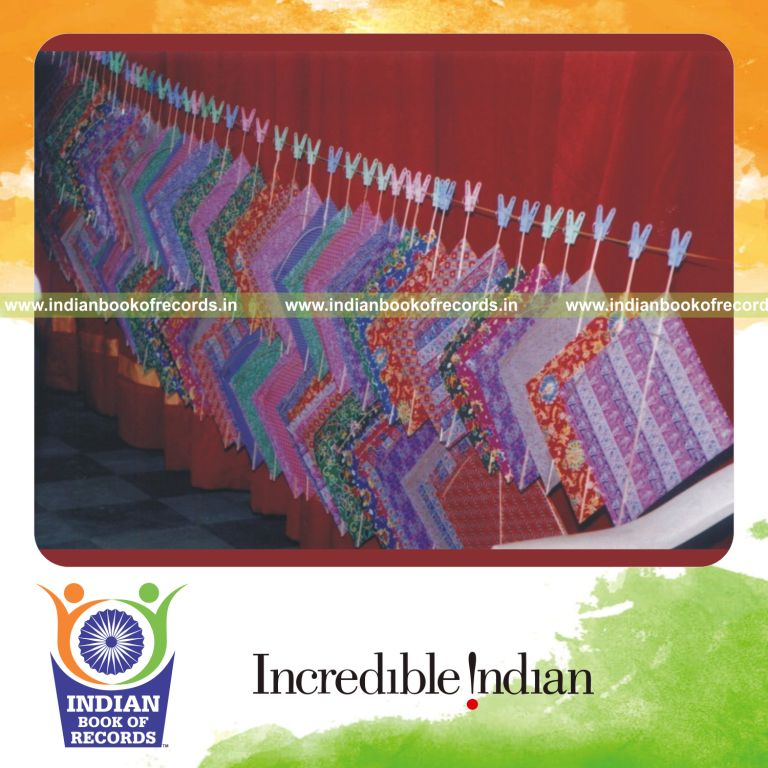 male individual making multiple kites within one hour for record in Indian Book of Records