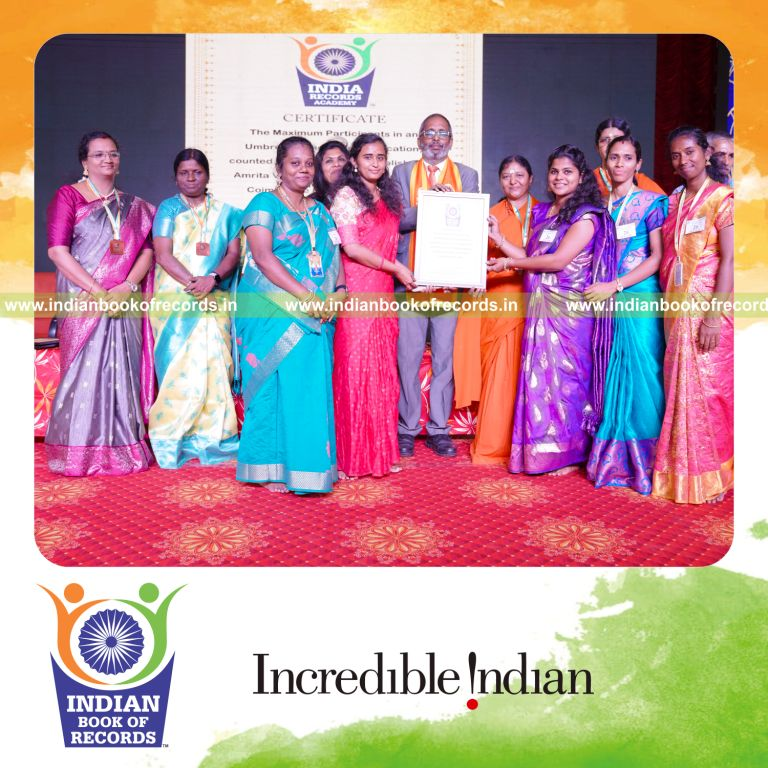 people performing an umbrella dance together at a single location in a coordinated event for a record in Indian Book of Records