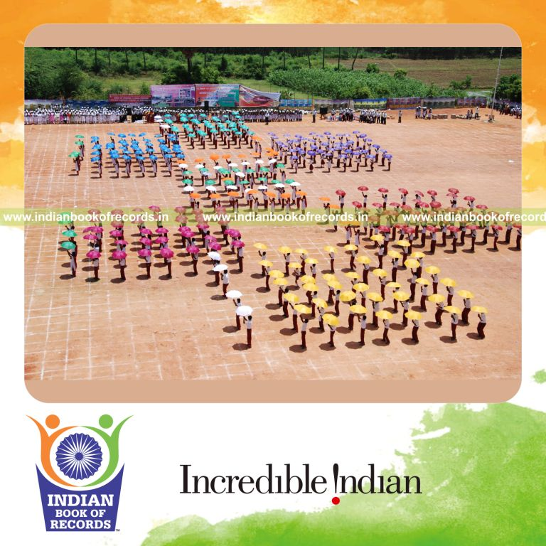 group of people dancing with umbrellas simultaneously at a single venue for record in Indian Book of Records