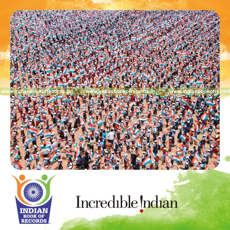 group of people twirling indian national flags simultaneously at single venue for record in Indian Book of Records