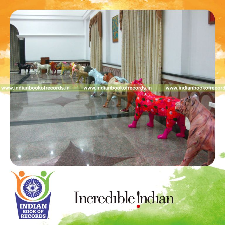 team painting multiple tiger models at a single venue for record in Indian Book of Records
