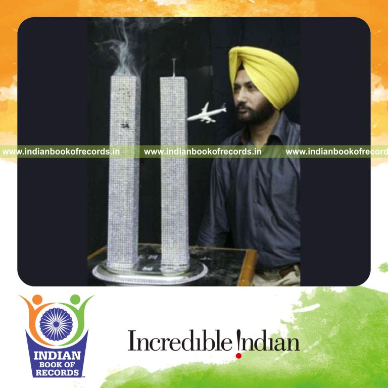 male individual creating miniature world trade centre model for record in Indian Book of Records