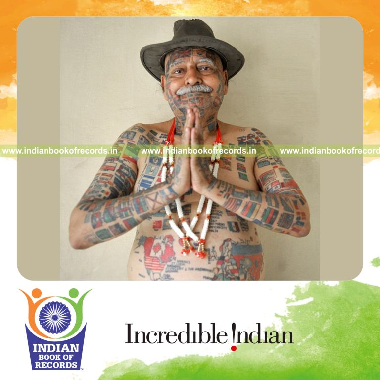 person with multiple permanent tattoos for record recognition in Indian Book of Records