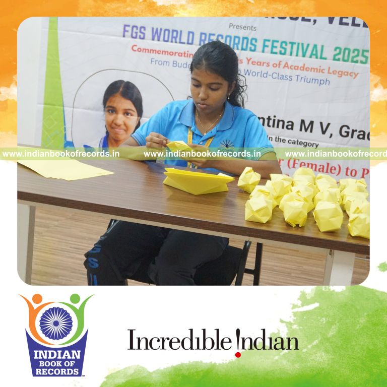 Young girl creating multiple origami balls within one hour recognized by Indian Book of Records