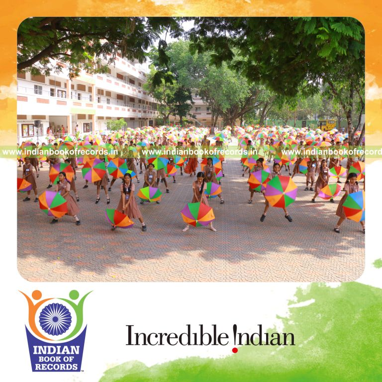 people performing an umbrella dance together at a single location in a coordinated event for an record in Indian Book of Records