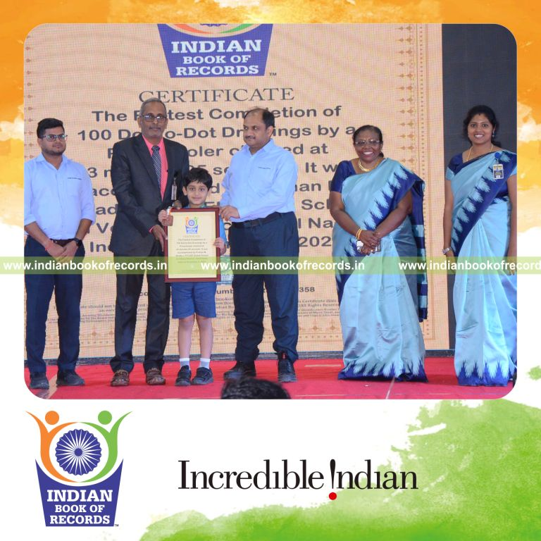 Preschool child completing numerous dot to dot drawings quickly during a timed activity recognized by Indian Book of Records
