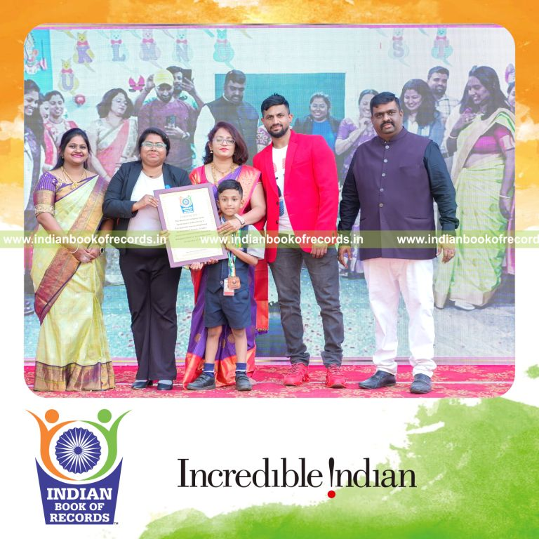 Preschool child performing continuous jumping jacks in a timed fitness activity recognized by Indian Book of Records