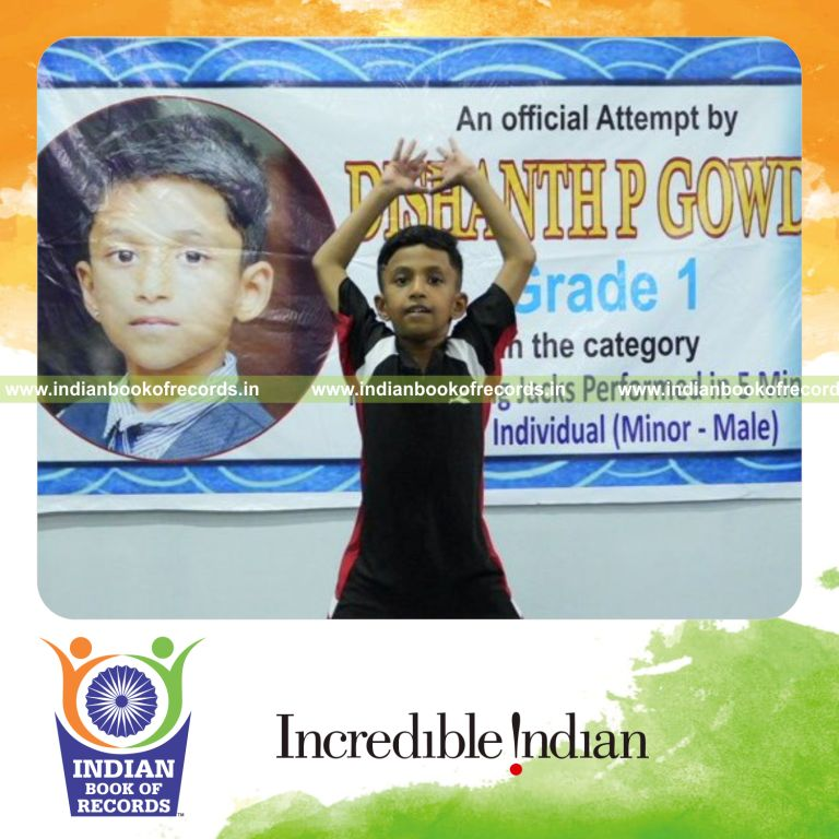 Preschool child actively performing rapid jumping jacks during a timed fitness challenge recognized by Indian Book of Records