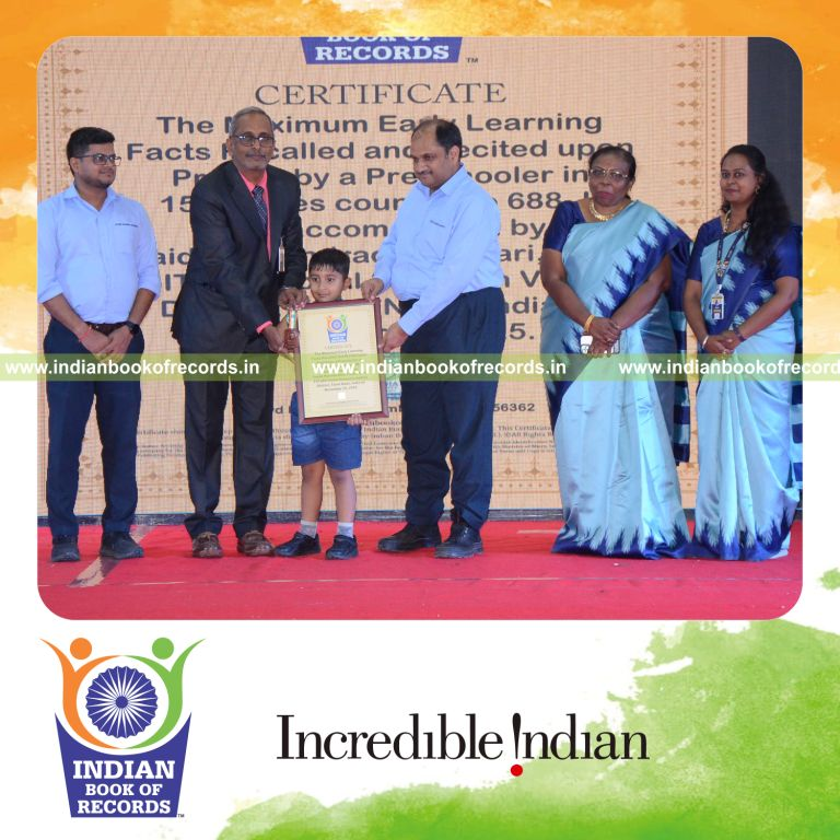 Preschool child actively recalling and reciting a large number of early learning facts during a timed session recognized by Indian Book of Records