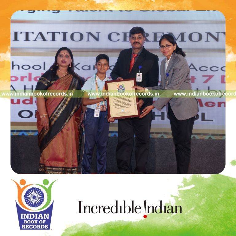 Young boy solving Pyraminx puzzle multiple times during a timed session recognized by Indian Book of Records