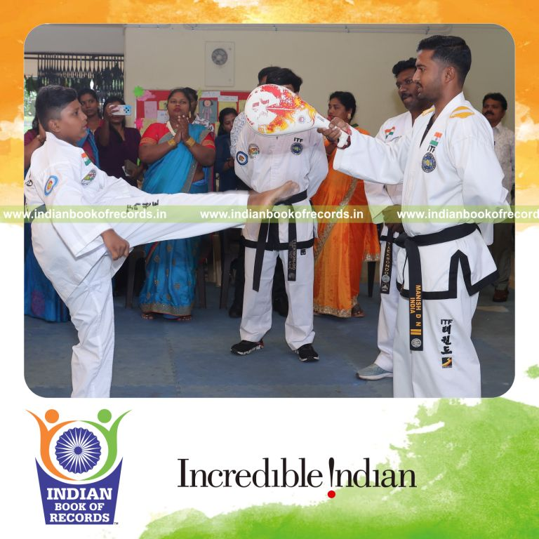 Young boy performing consecutive high roundhouse kicks at head level within a timed session recognized by Indian Book of Records