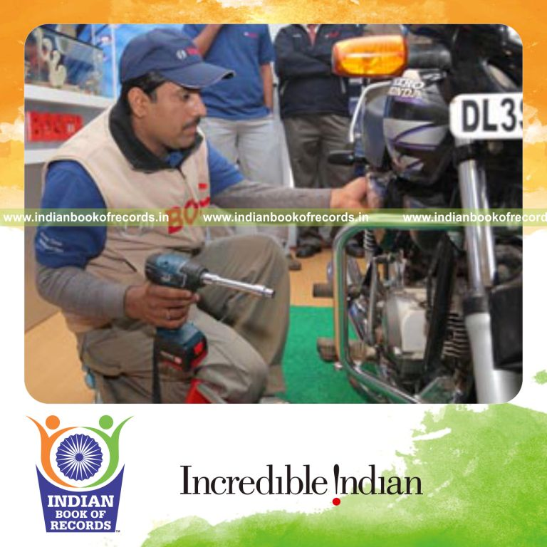 male individual quickly dismantling and assembling a bike for record in Indian Book of Records