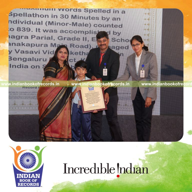 Young boy spelling numerous words quickly during a spellathon recognized by Indian Book of Records