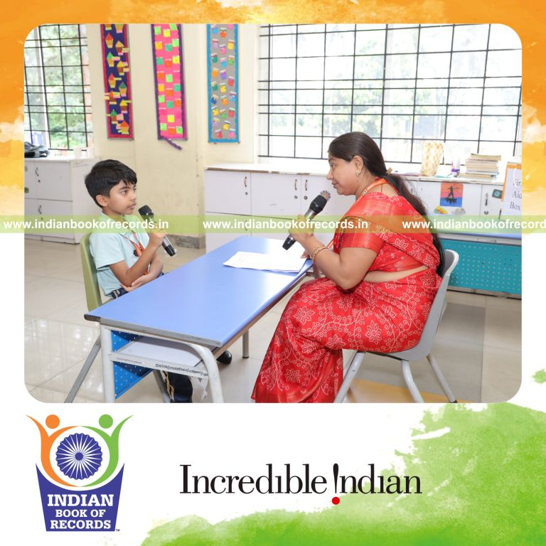 Young boy spelling numerous words during a spellathon within 30 minutes recognized by Indian Book of Records
