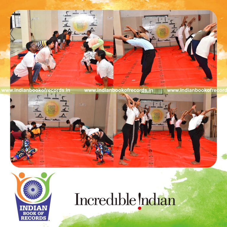 Large group performing Surya Namaskar in a relay format over four hours recognized by Indian Book of Records