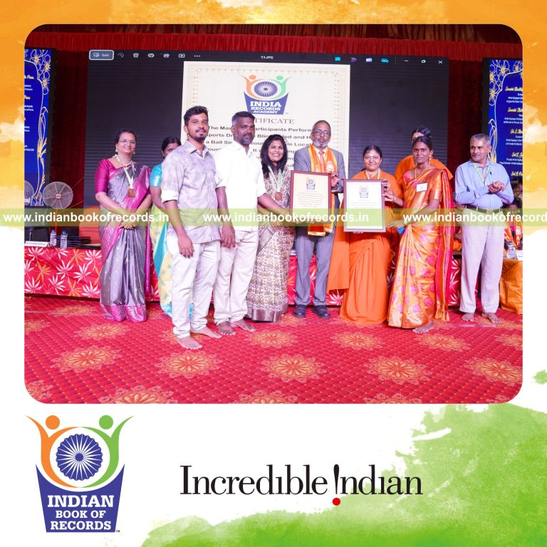 Large group executing sports drills together while holding umbrellas for Indian Book of Records