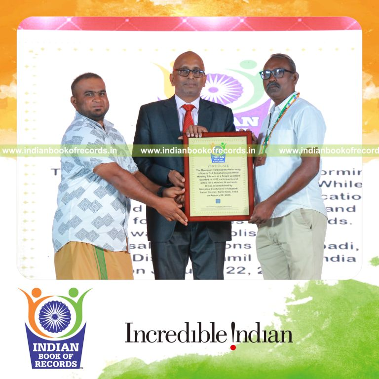 Participants performing a synchronized sports drill while holding ribbons at one venue recognized by Indian Book of Records