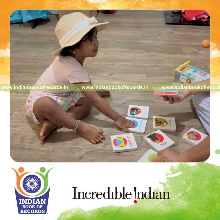 Toddler quickly identifying multiple board books during a timed activity recognized by Indian Book of Records