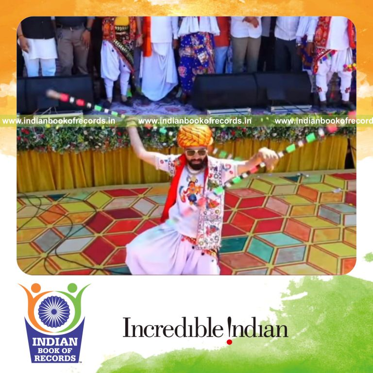 Individual spinning wooden sticks rapidly using both hands within one minute recognized by Indian Book of Records